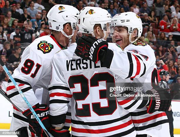 Brad Richards, Kris Versteeg and Patrick Kane of the Chicago Blackhawks celebrate Kane's second period goal against the Anaheim Ducks on November 28,...