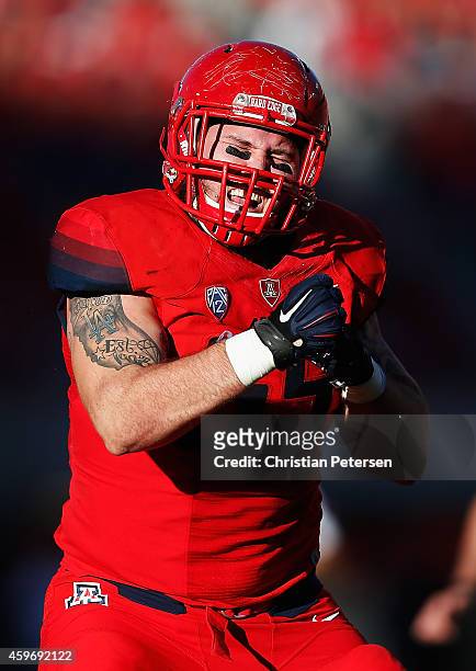 Defensive lineman Jeff Worthy of the Arizona Wildcats celebrates after a tackle in the back field during the Territorial Cup college football game...