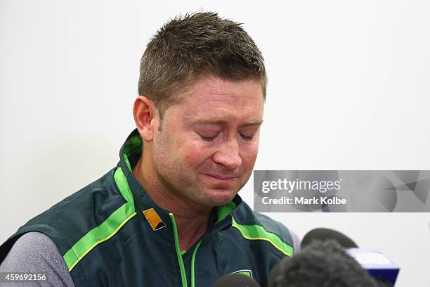 Australian cricket captain Michael Clarke pauses as he reads a statement on behalf of the Australian cricket team in response to the death of...