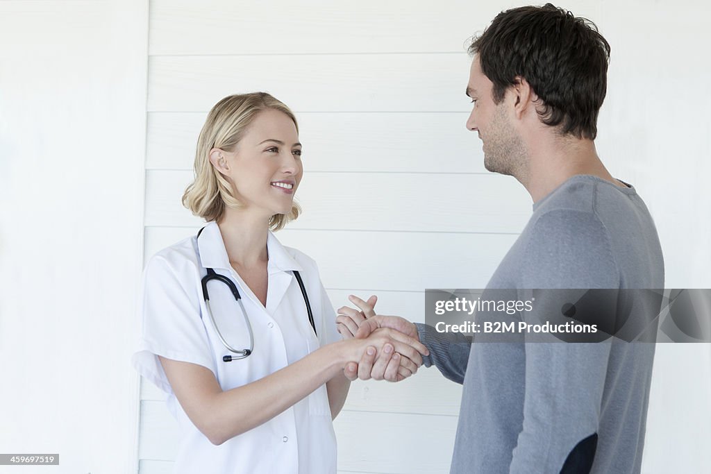 Doctor and patient shaking their hand