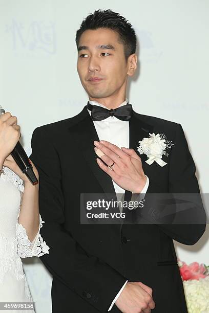 Actor Mark Zhao shows his finger ring during his wedding ceremony with actress Yuanyuan Gao at Le Meridien Taipei Hotel on November 28, 2014 in...