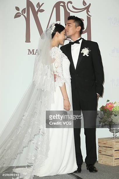 Actor Mark Zhao kisses actress Yuanyuan Gao during their wedding ceremony at Le Meridien Taipei Hotel on November 28, 2014 in Taipei, Taiwan of China.