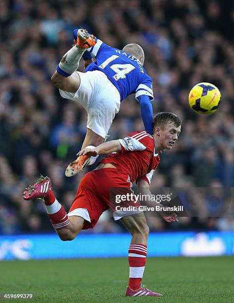 James Ward-Prowse of Southampton tangles with Steven Naismith of Everton during the Barclays Premier League match between Everton and Southampton at...