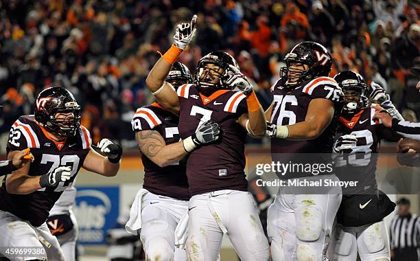 Tight end Bucky Hodges celebrates his eventual game winning touchdown with offensive lineman David Wang of the Virginia Tech Hokies in the second...