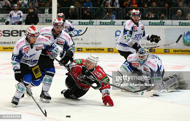 Philip Gogulla of Koeln and David Sulkovsky of Schwenningen battle for the puck during the DEL match between Koelner Haie and Schwenninger Wild Wings...