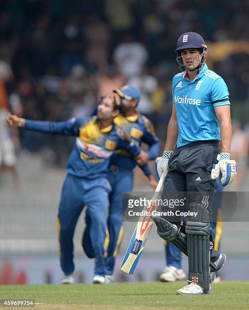 England captain Alastair Cook leaves the field after being dismissed by Tillakaratne Dilshan of Sri Lanka during the 2nd One Day International match...