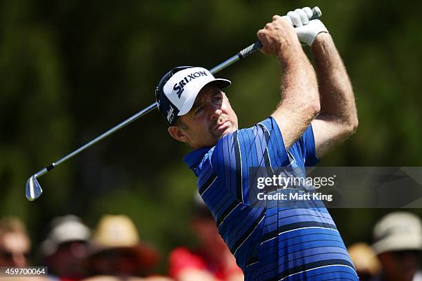 Rod Pampling of Australia plays his tee shot on the 11th hole during day three of the Australian Open at The Australian Golf Course on November 29,...
