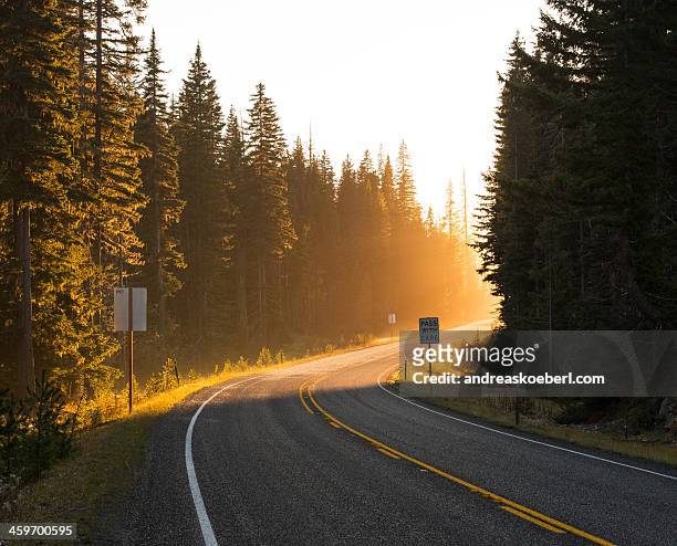 highway turn in washington state at sunset - two lane highway stock pictures, royalty-free photos & images