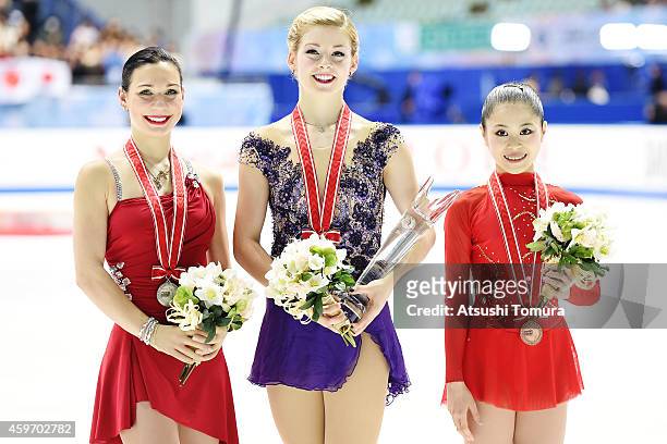 Alena Leonova of Russia , Gracie Gold of the USA and Satoko Miyahara of Japan pose with medal in the victory ceremony during day two of ISU Grand...