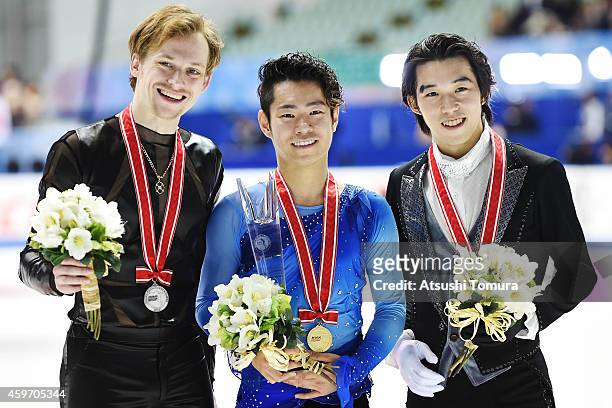 Sergei Voronov of Russia , Daisuke Murakami of Japan and Takahito Mura of Japan pose with their medals in the victory ceremony during day two of ISU...