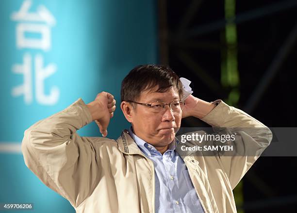 Newly-elected independent Taipei mayor Ko Wen-je gestures after winning the Taipei mayoral elections in Taipei on November 29, 2014. Taiwan's premier...