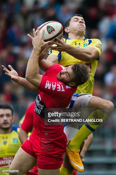 Clermont's fullback Jean-Marcelin Butin vies with RC Toulon's winger Drew Mitchell during the French Top 14 rugby union match RC Toulon vs Clermont...