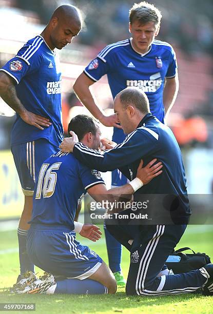Noel Hunt of Ipswich Town receives medical help after suffering an injury to his face during the Sky Bet Championship match between Charlton Athletic...