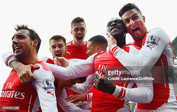 Danny Welbeck of Arsenal celebrates with team mates Olivier Giroud, Santi Cazorla, Calum Chambers and Aaron Ramsey of Arsenal as he scores their...