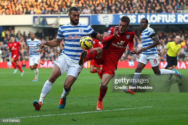 Jamie Vardy of Leicester City battles for the ball with Steven Caulker of QPR during the Barclays Premier League match between Queens Park Rangers...