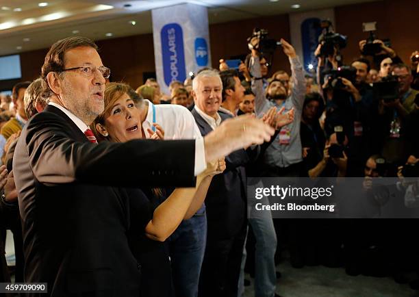 Mariano Rajoy, Spain's prime minister, left, and Alicia Sanchez-Camacho, leader of the Popular Party in Catalonia, second left, arrive to speak at a...