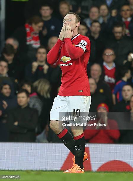 Wayne Rooney of Manchester United celebrates scoring their second goal during the Barclays Premier League match between Manchester United and Hull...