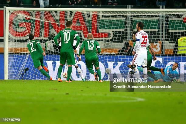 Paul Verhaegh of Augsburg scores the 3rd team goal with a penalty against Jaroslav Drobny, keeper of Hamburg during the Bundesliga match between FC...