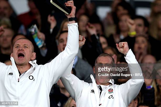 Graham Rowntree, the England forwards coach, celebrates with Stuart Lancaster the head coach of England after winning the QBE international match...