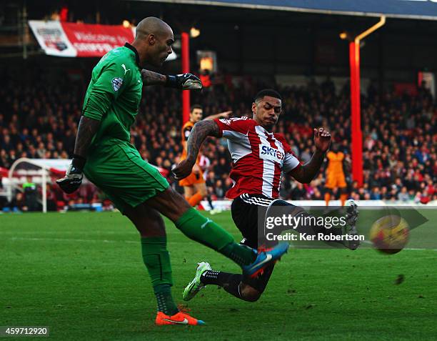 Carl Ikem the Wolverhampton Wanderers goalkeeper clears the ball under pressure from Andre Gray of Brentford during the Sky Bet Championship match...