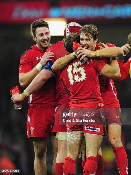 Wales players Alex Cuthbert Leigh Halfpenny and Liam Williams celebrate after the Autumn international match between Wales and South Africa at...