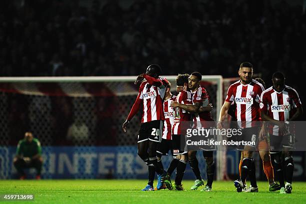 Andre Gray of Brentford celebrates with team mates after scoring during the Sky Bet Championship match between Brentford and Wolverhampton Wanderers...