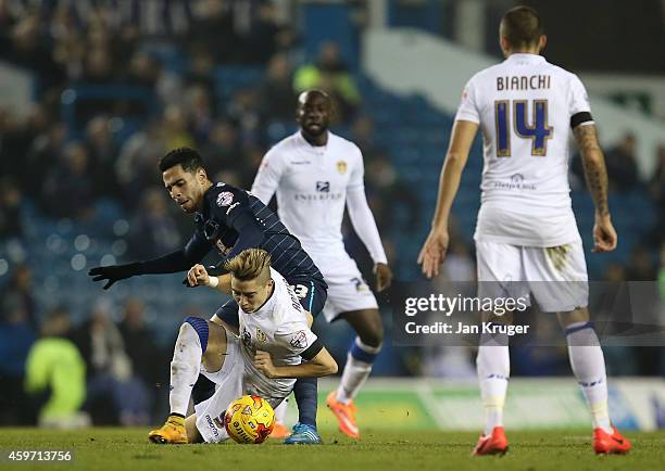 Adryan of Leeds is challenged by Omar Mascarell of Derby County during the Sky Bet Championship match between Leeds United and Derby County at Elland...