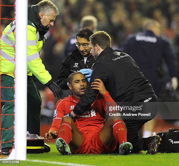 Glen Johnson of Liverpool recieves treatment for a head injury after scoring his goal during the Barclays Premier Leauge match between Liverpool and...