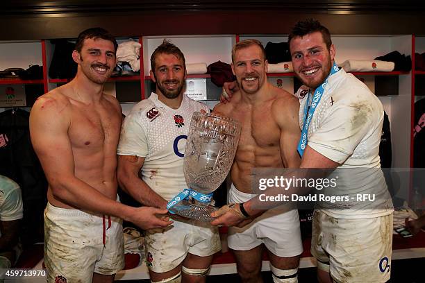 Tom Wood of England, Chris Robshaw of England, James Haskell of England and Ben Morgan of England celebrate with the Cook Cup after winning the QBE...