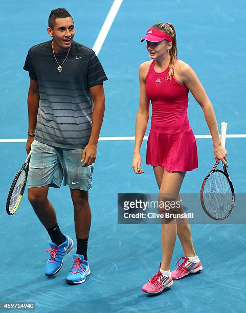 Daniela Hantuchova and substitute player Nick Kyrgios of the Singapore Slammers discuss tatics against Kristina Mladenovic and Nenad Zimonjic of the...