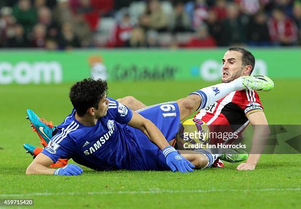 John O'Shea and Diego Costa in a full blooded challenge during the Barclays Premier League match between Sunderland AFC and Chelsea at the Stadium of...