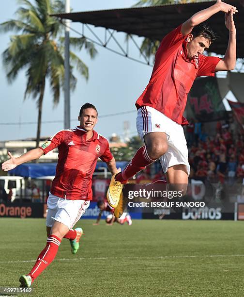 Egyptian's Al Ahly player Hassan Mahmoud Ibrahim celebrates a team goal on November 29, 2014 at Robert Champroux stadium in Abidjan during their...