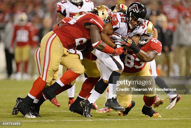 Jacquizz Rodgers of the Atlanta Falcons returning a kick off gets tackled by Anthony Dixon Demarcus Dobbs of the San Francisco 49ers at Candlestick...