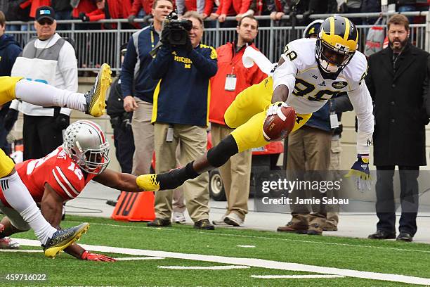 Quarterback Devin Gardner of the Michigan Wolverines dives for a first down in the second quarter at Ohio Stadium on November 29, 2014 in Columbus,...