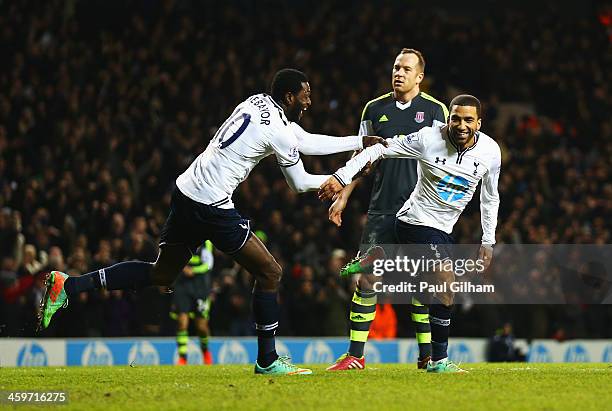 Aaron Lennon of Tottenham Hotspur celebrates his team's third goal with Emmanuel Adebayor during the Barclays Premier League match between Tottenham...