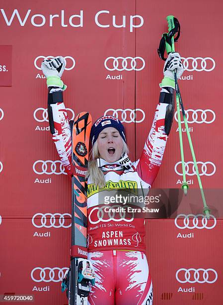Eva-Maria Brem of Austria celebrates on the podium after winning the ladies' giants slalom during the 2014 Audi FIS Ski World Cup at the Nature...