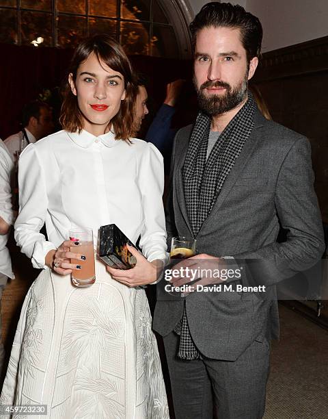 Alexa Chung and Jack Guinness attend the British Fashion Awards Nominees' Dinner hosted by Grey Goose at the Soho House Pop-Up on November 29, 2014...