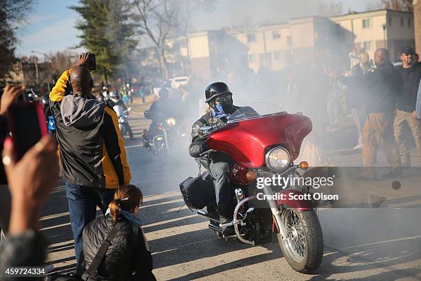 Group of bikers and others visit the Michael Brown memorial prior to the start of a Journey for Justice, seven-day 120-mile march, sponsored by the...