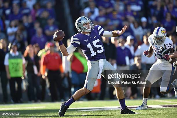 Quarterback Jake Waters of the Kansas State Wildcats throws a pass down field against the Kansas Jayhawks during the first half on November 29, 2014...