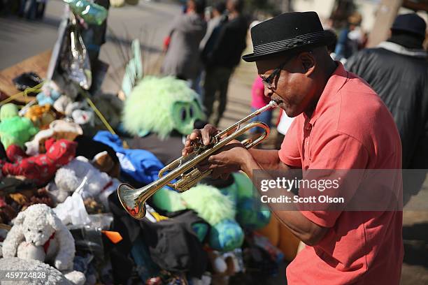 Eugene Gillis plays a trumpet at the Michael Brown memorial on November 29, 2014 in Ferguson, Missouri. The Ferguson area has been struggling to...