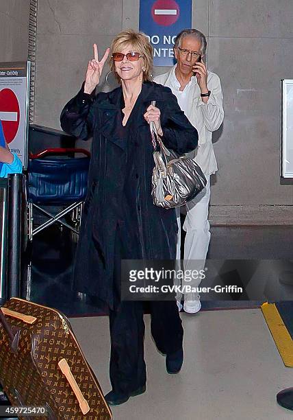 Jane Fonda and Richard Perry are seen at Los Angeles International Airport on June 08, 2012 in Los Angeles, California.