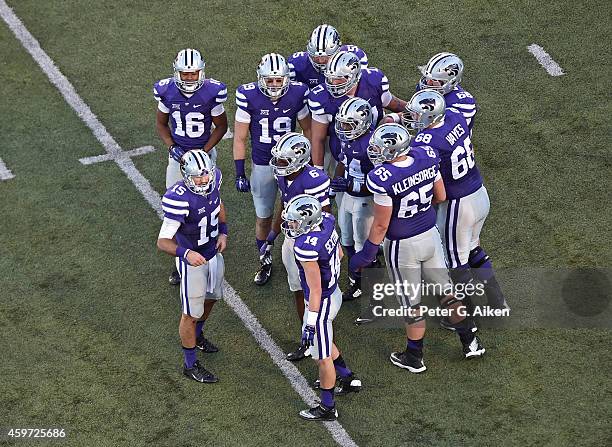 Quarterback Jake Waters of the Kansas State Wildcats looks to the sideline against the Kansas Jayhawks during the first half on November 29, 2014 at...