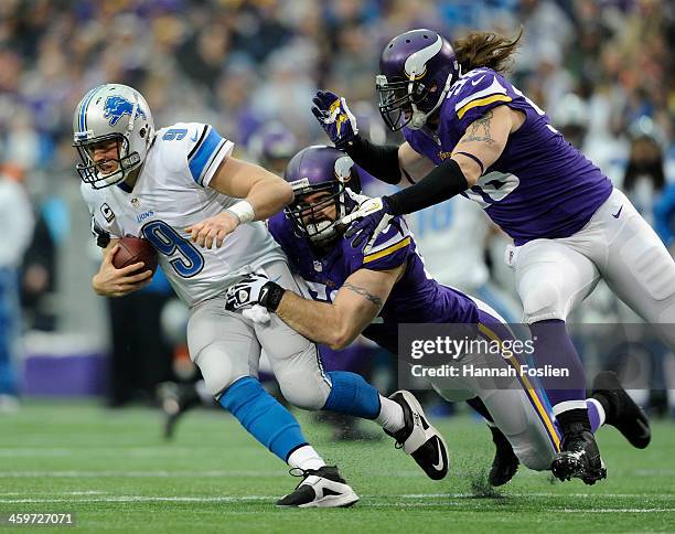 Matthew Stafford of the Detroit Lions is sacked by Jared Allen and Brian Robison of the Minnesota Vikings during the first quarter of the game on...