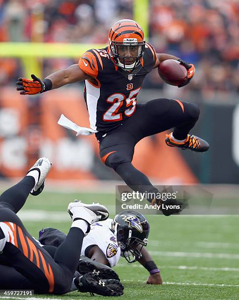 Giovani Bernard of the Cincinnati Bengals runs with the ball during the NFL game against the Baltimore Ravens at Paul Brown Stadium on December 29,...