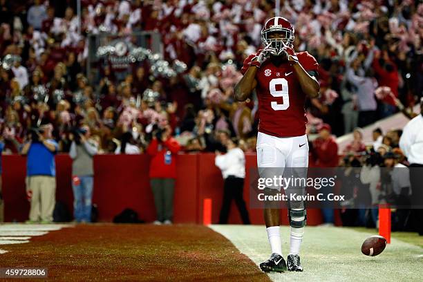 Amari Cooper of the Alabama Crimson Tide celebrates after catching a 39 yard touchdown pass thrown by Blake Sims in the third quarter against the...