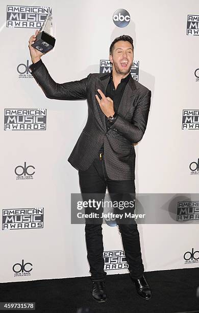 Singer Luke Bryan poses in the press room at the 2014 American Music Awards at Nokia Theatre L.A. Live on November 23, 2014 in Los Angeles,...