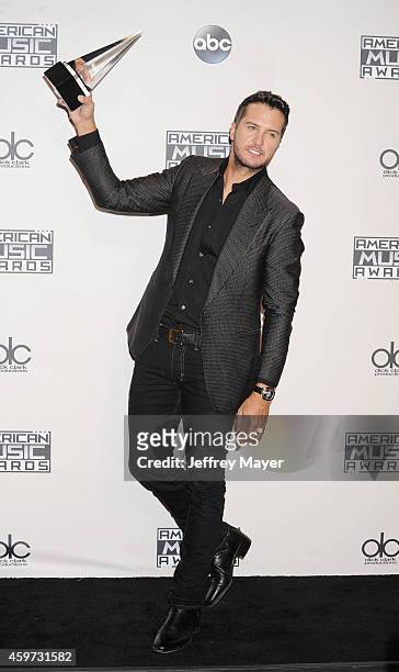Singer Luke Bryan poses in the press room at the 2014 American Music Awards at Nokia Theatre L.A. Live on November 23, 2014 in Los Angeles,...