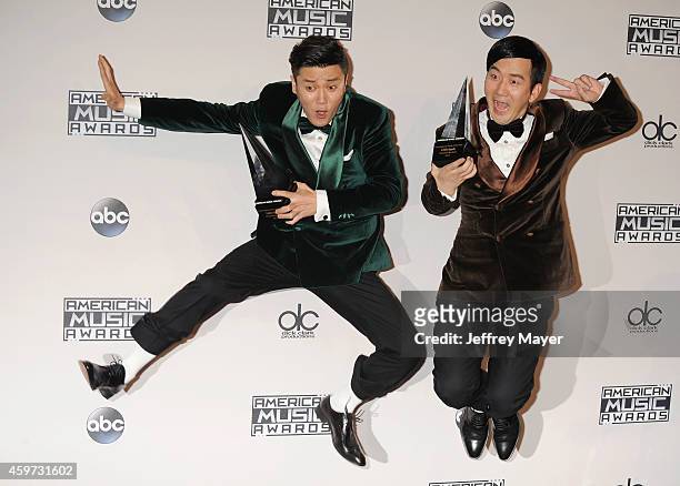 Singers Xiao Yang and Wang Taili of the Chopstick Brothers pose in the press room at the 2014 American Music Awards at Nokia Theatre L.A. Live on...