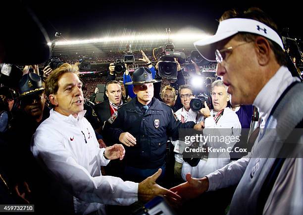 Head coach Nick Saban of the Alabama Crimson Tide shakes hand with head coach Gus Malzahn of the Auburn Tigers after the Iron Bowl at Bryant-Denny...