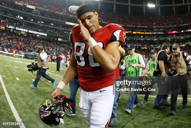 Tony Gonzalez of the Atlanta Falcons walks off the field after their 21-20 loss to the Carolina Panthers at Georgia Dome on December 29, 2013 in...